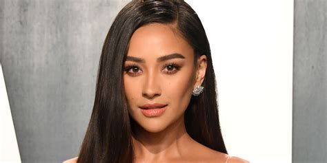 Shay Mitchell shows off her toned figure in a green bikini